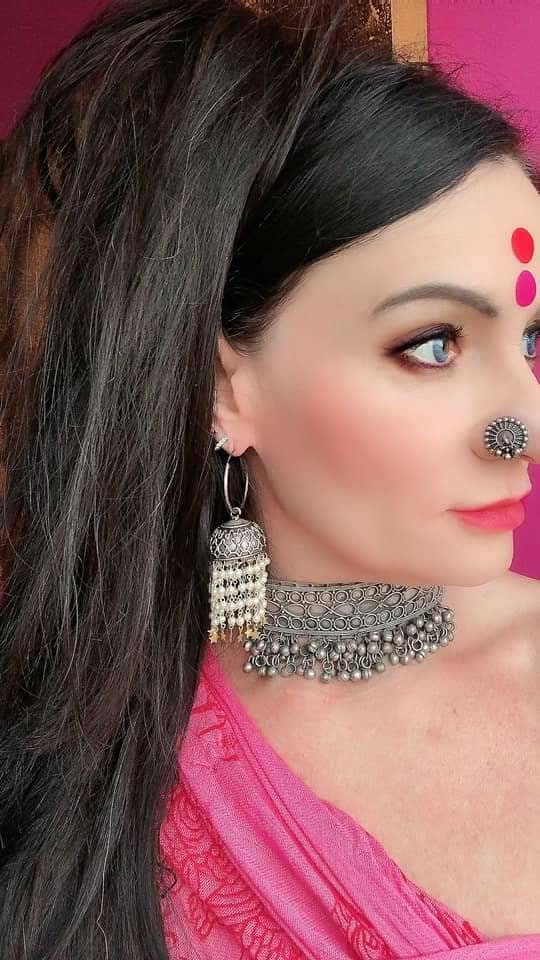 Pearl Star Jhumka Earrings: Carved Metal Drop Earrings