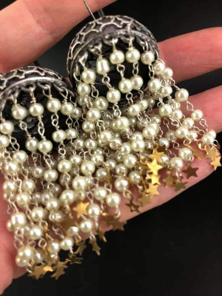 Pearl Star Jhumka Earrings: Carved Metal Drop Earrings