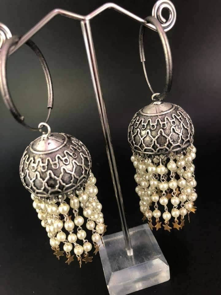 Pearl Star Jhumka Earrings: Carved Metal Drop Earrings