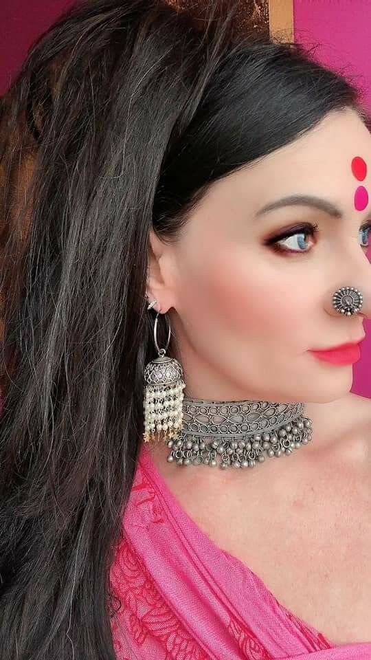 Pearl Star Jhumka Earrings: Carved Metal Drop Earrings