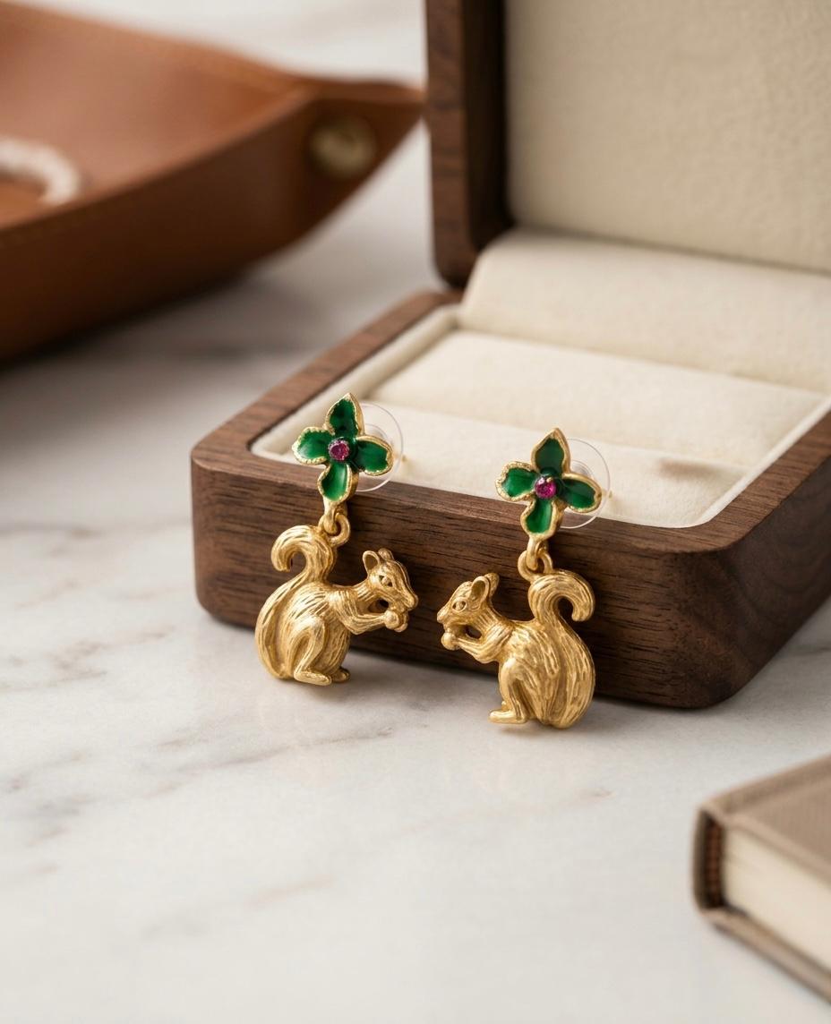 Whimsical Gold Squirrel Dangle Earrings with Green Enamel Flower Accent